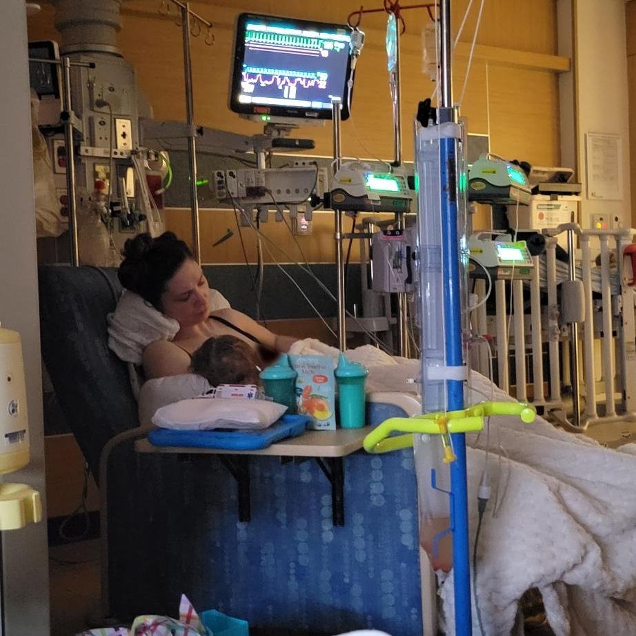 Max and Natalia sleeping in a hospital bed